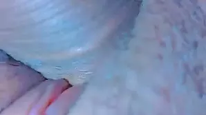 Cute babe in glasses takes a foot fetish video