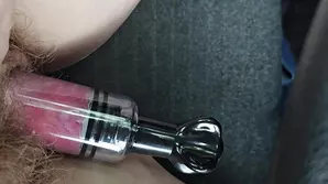 A beautiful model in a backlight swinging on the ceiling in stunning attire