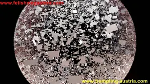 Girl put on a mesh bag and lay naked in the glass case