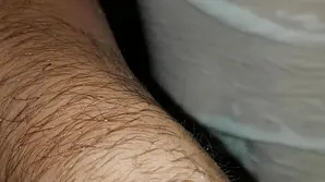 A man is pushing his cock in a girl's mouth