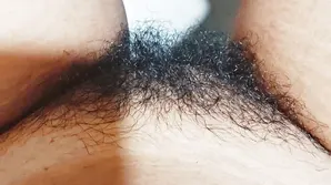 Young blonde poses for her webcam wearing sexy stockings and a black suit