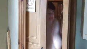 A naked girl is playing with her favorite toy